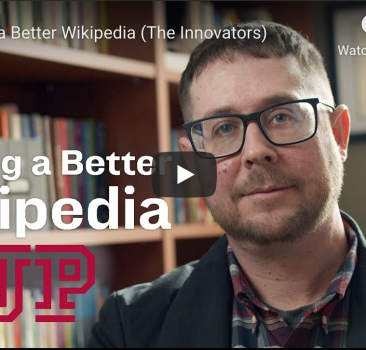 Dr. Vetter in his office with the title "Making a Better Wikipedia"